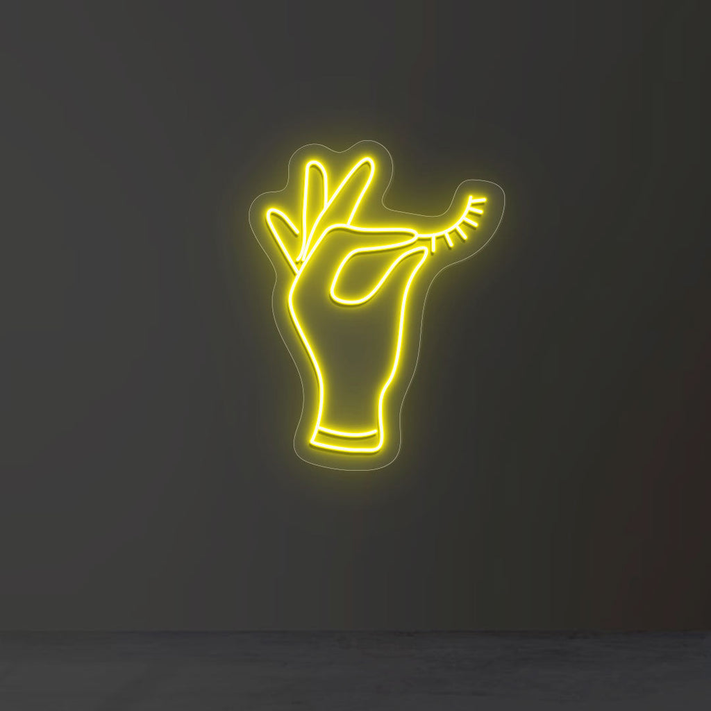 Hand Holding Eyelash Neon Sign