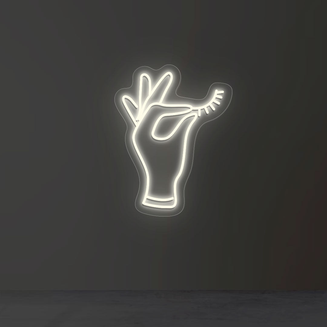 Hand Holding Eyelash Neon Sign