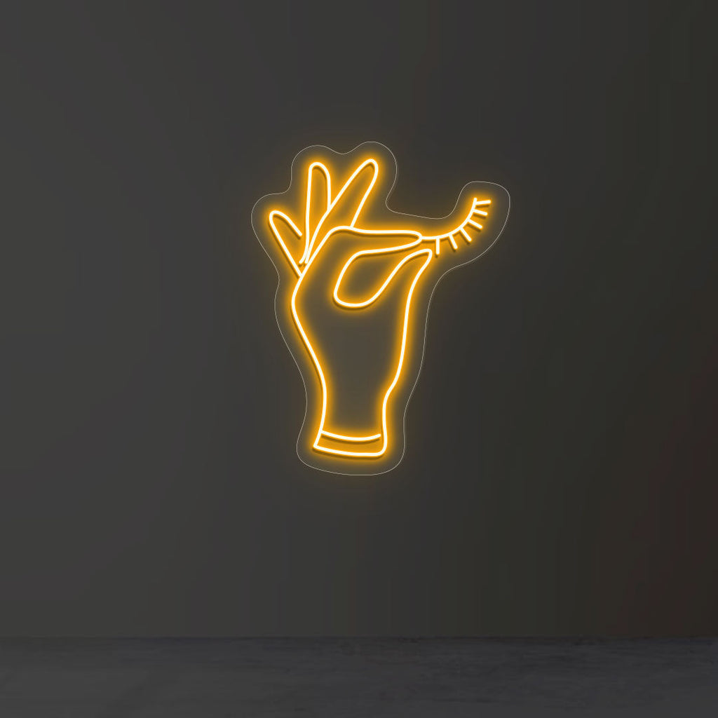 Hand Holding Eyelash Neon Sign